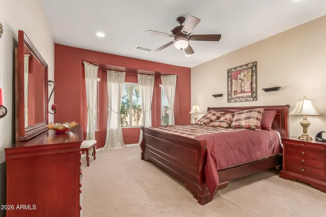 a bed room with a bed and a large window