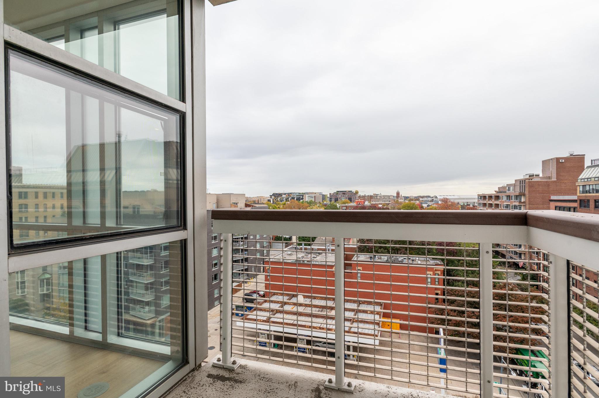 1300 13th Street Northwest, Unit 801 Washington, DC 20005 - Photo 10 of 28 The living/dining room leads to 2 balconies