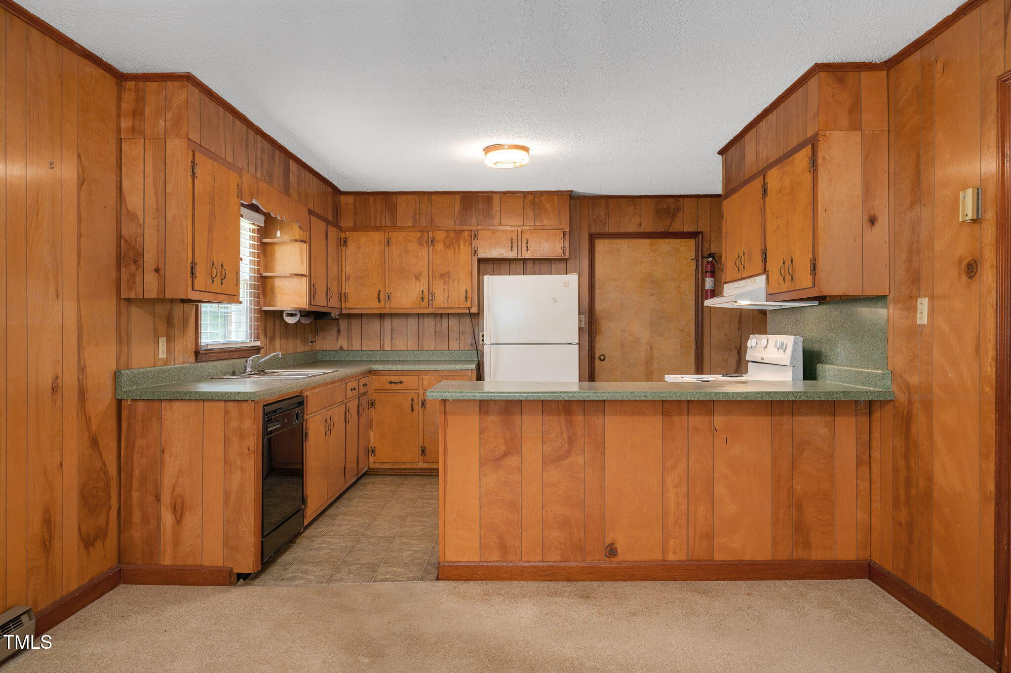 202 Hamilton Road Bunnlevel, NC 28323 - Photo 12 of 31 a kitchen with stainless steel appliances wooden cabinets a refrigerator and a sink