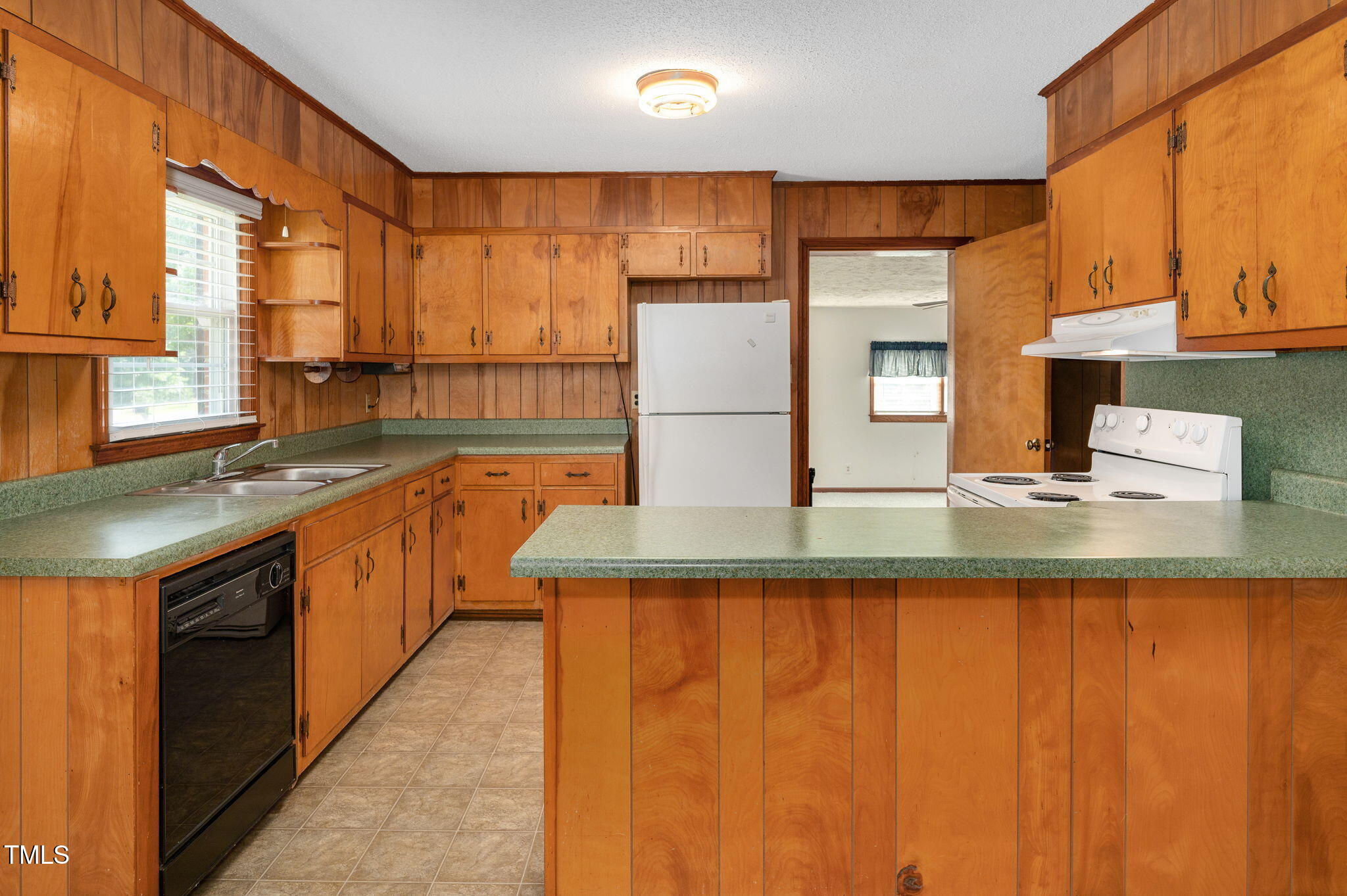 202 Hamilton Road Bunnlevel, NC 28323 - Photo 15 of 31 a kitchen with stainless steel appliances granite countertop a sink and a counter top space