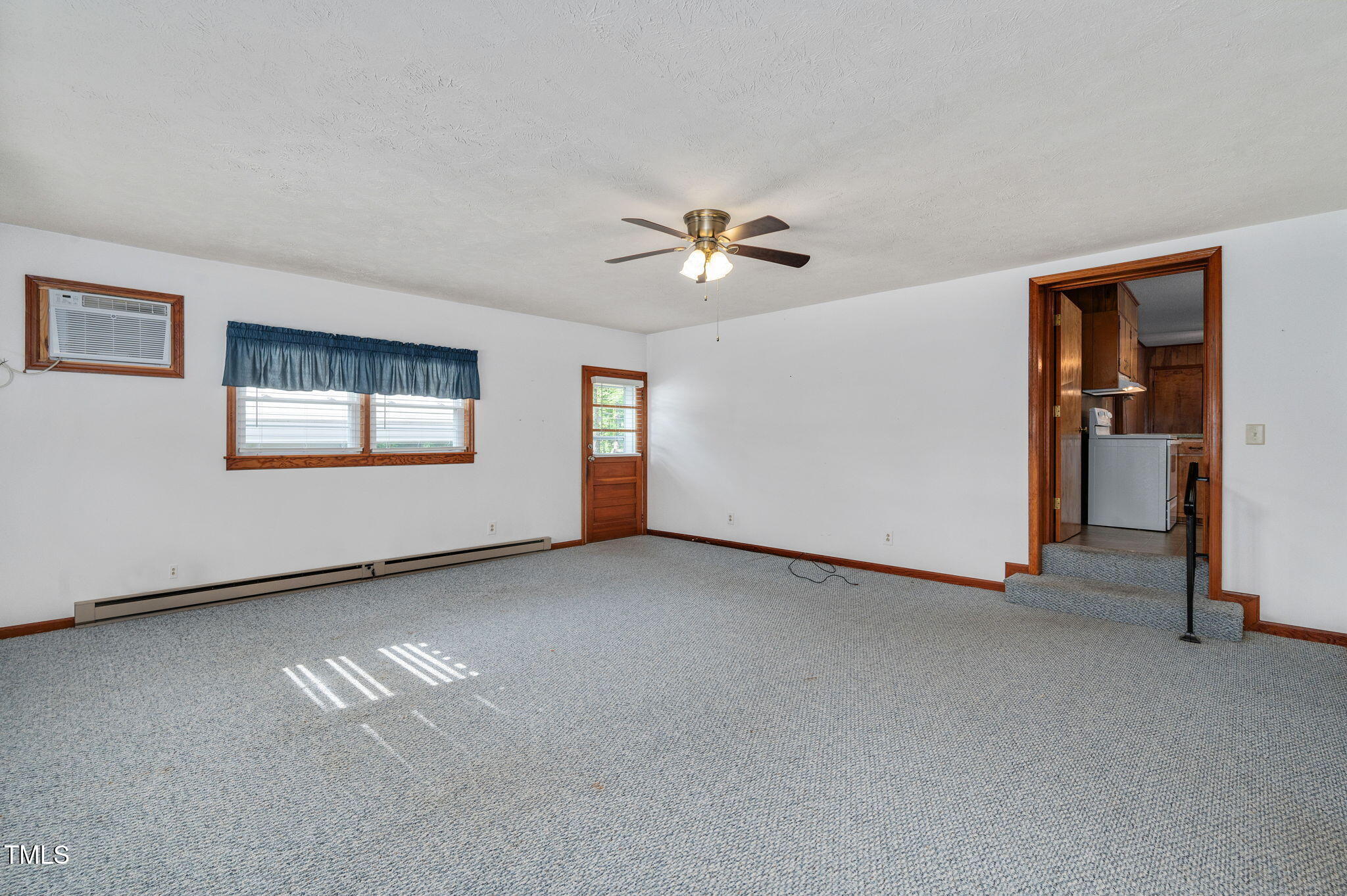 202 Hamilton Road Bunnlevel, NC 28323 - Photo 19 of 31 a view of a livingroom with a ceiling fan and window