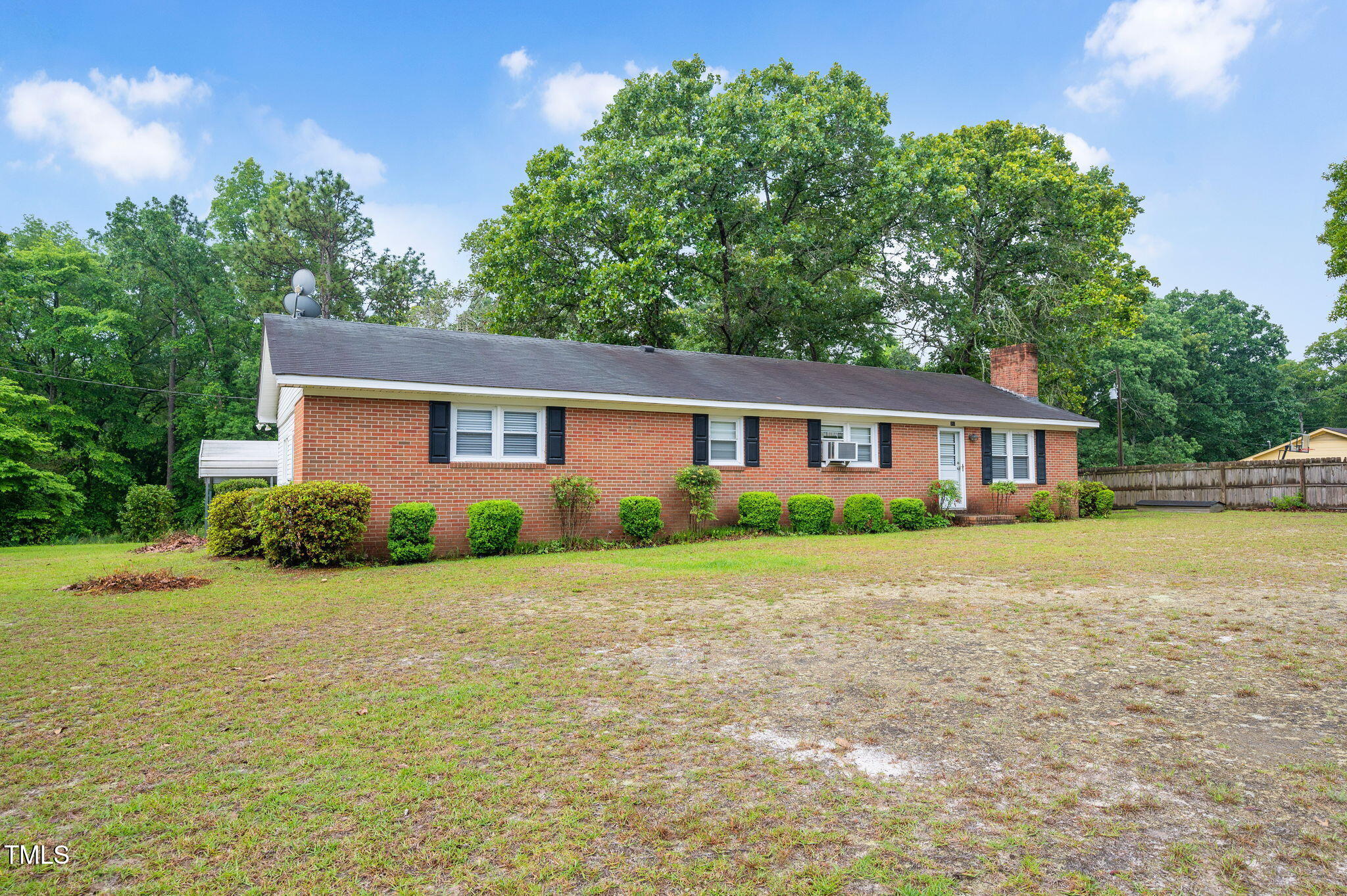 202 Hamilton Road Bunnlevel, NC 28323 - Photo 3 of 31 a front view of a house with a garden
