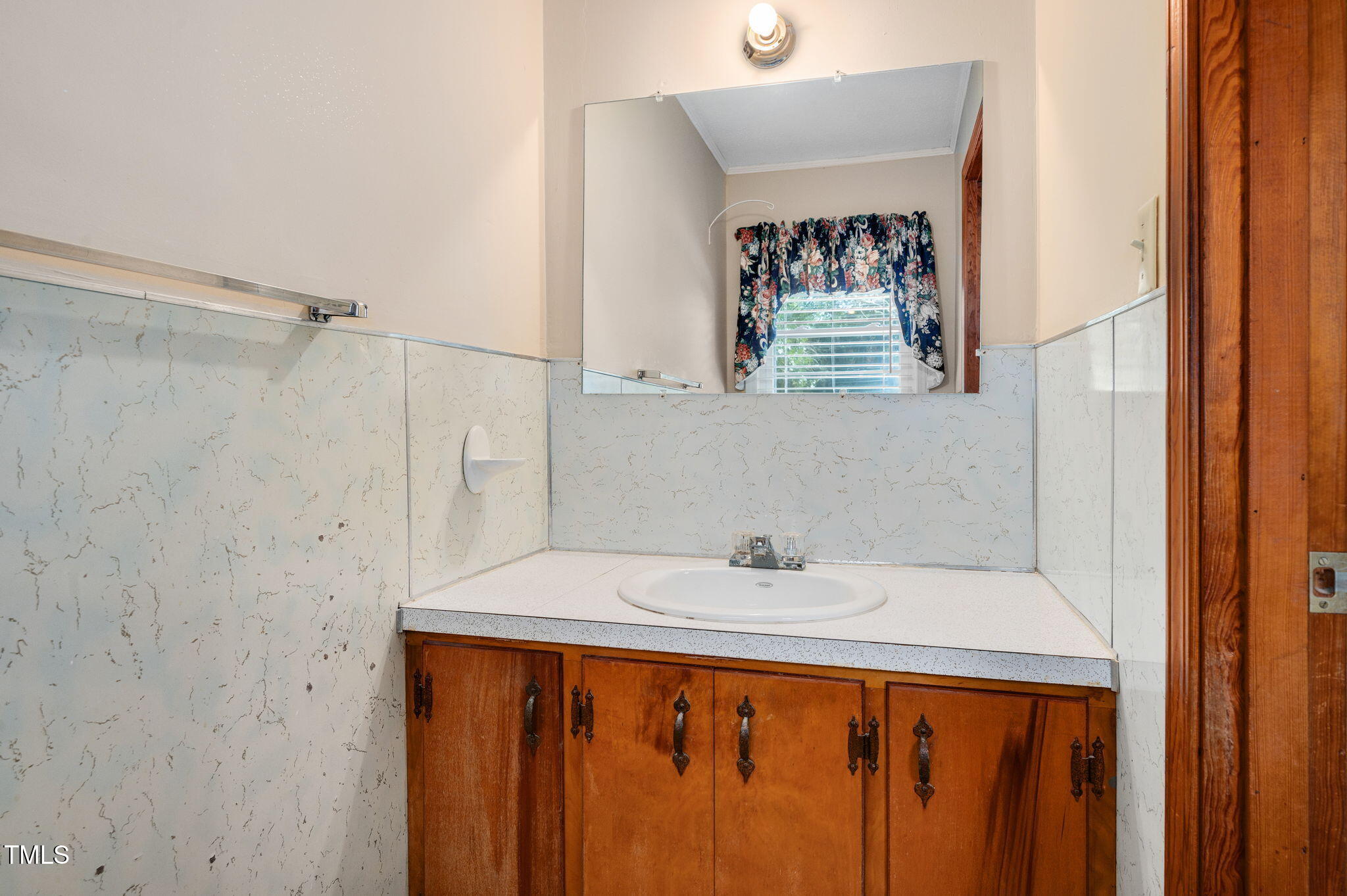 202 Hamilton Road Bunnlevel, NC 28323 - Photo 31 of 31 a bathroom with a sink and a window