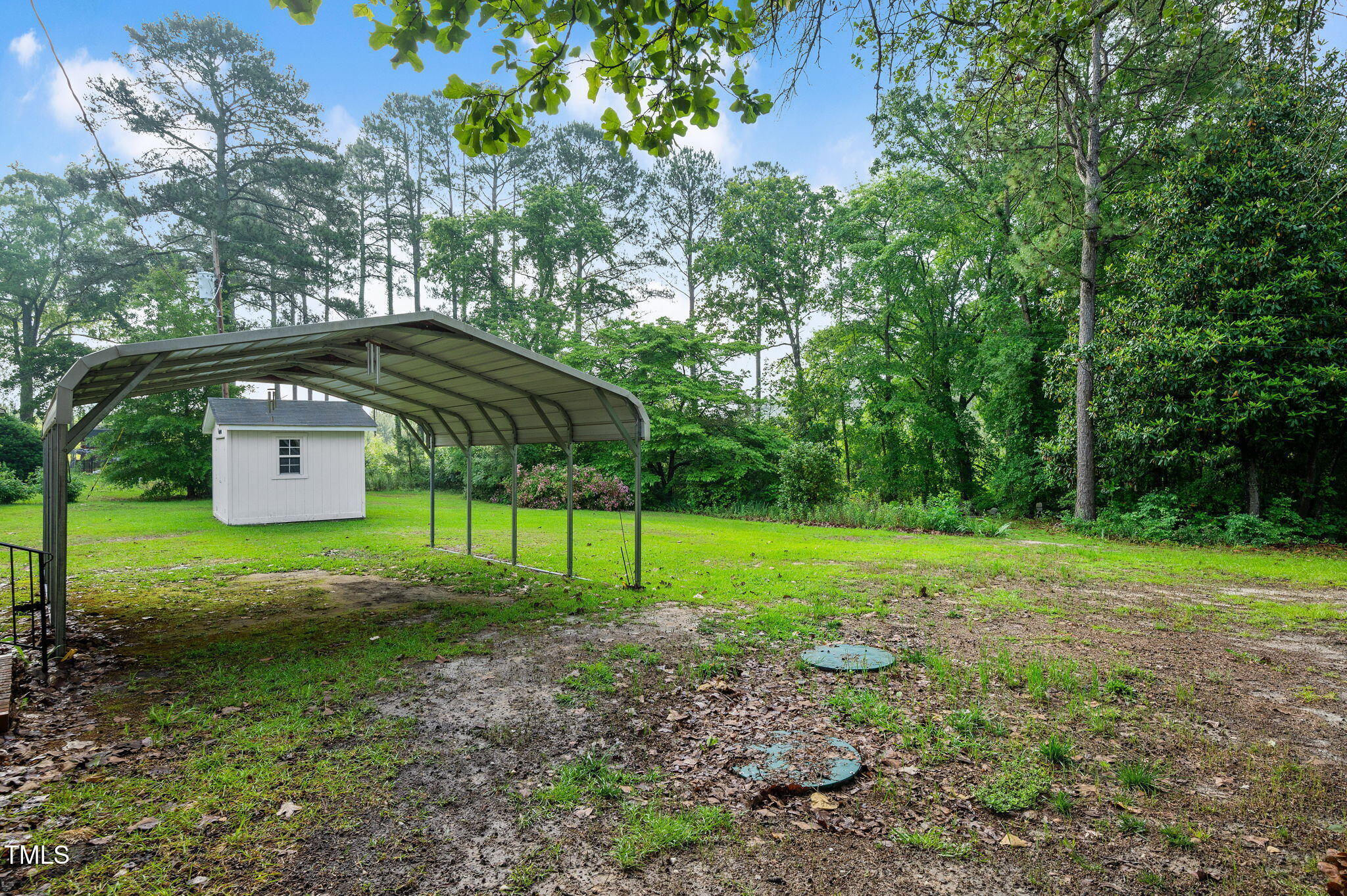 202 Hamilton Road Bunnlevel, NC 28323 - Photo 7 of 31 a view of a backyard with a barn and large trees