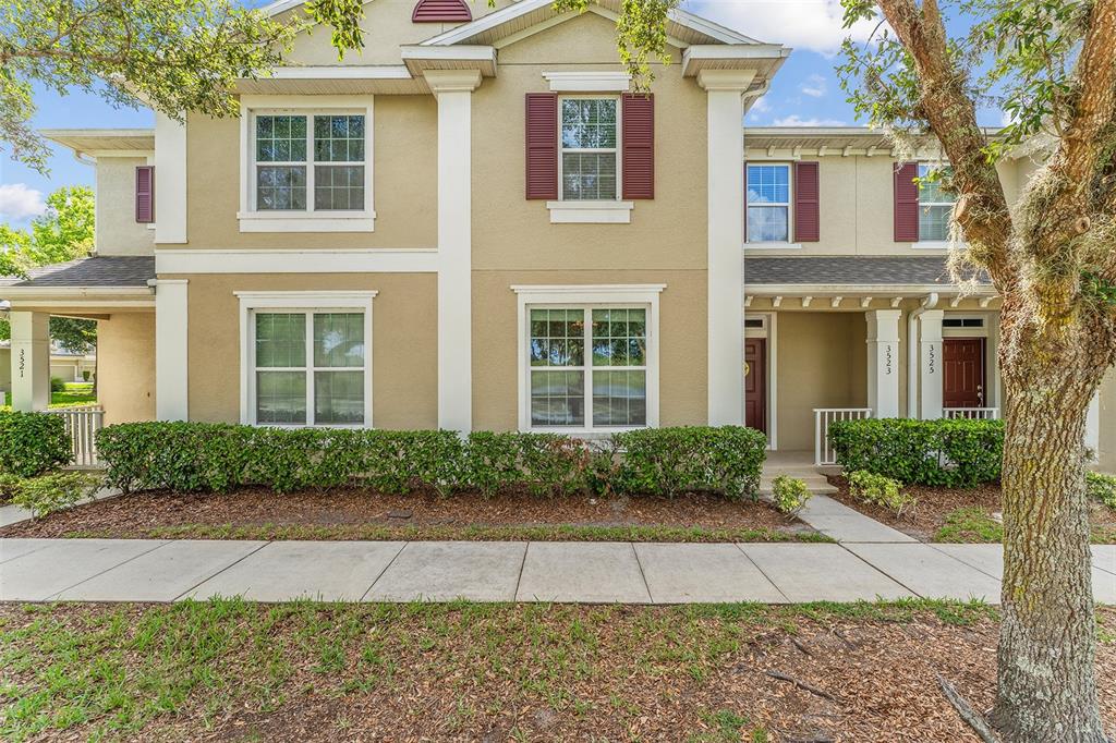 3523 Clay Brick Road St. Cloud, FL 34773 - Photo 29 of 62 a front view of a house with garden