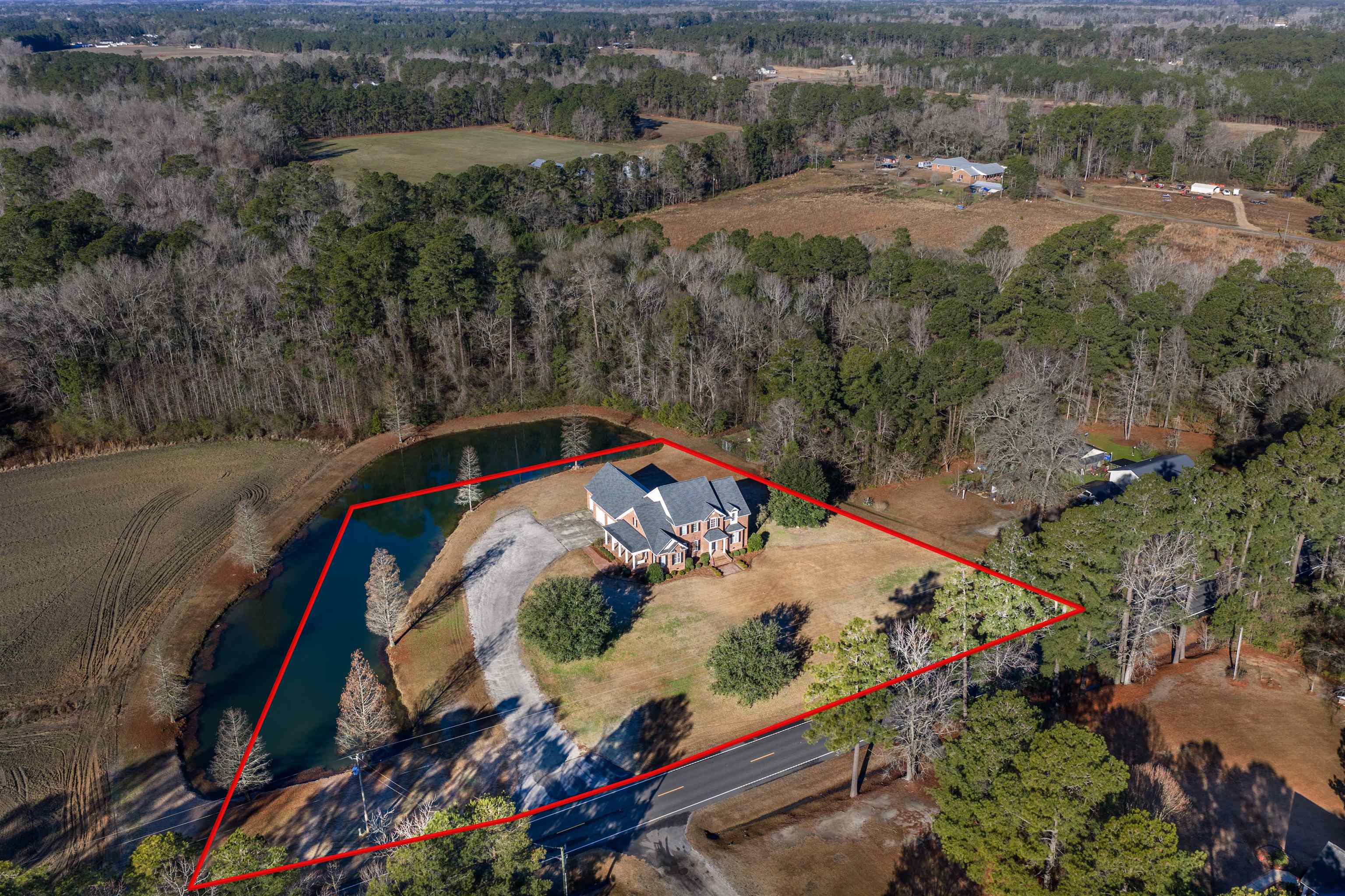 4310 Enoch Road Aynor, SC 29511 - Photo 2 of 39 Aerial view of property and surrounding area featuring a large body of water and property parcel outlined