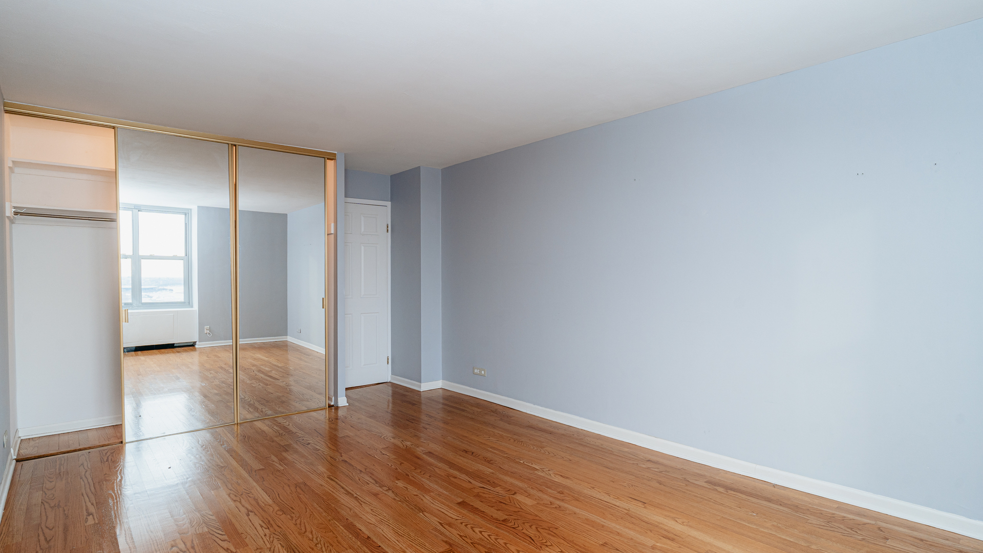 400 East Randolph Street, Unit 3915 Chicago, IL 60601 - Photo 8 of 16 a view of livingroom with hardwood floor