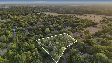 an aerial view of house with yard