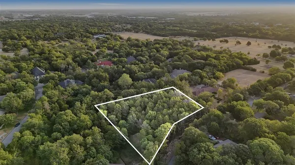 an aerial view of house with yard
