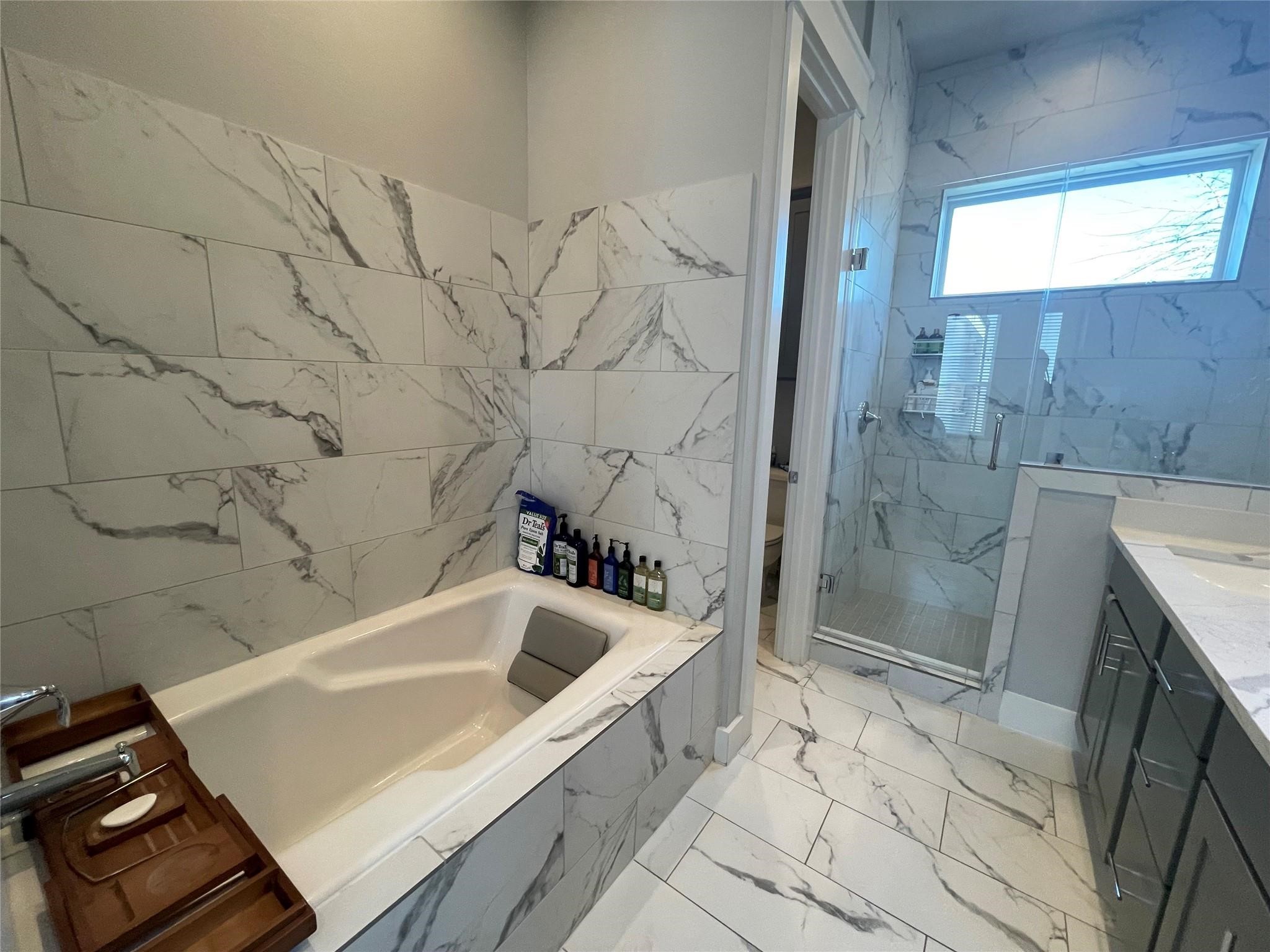 902 Martin Street, Unit A Houston, TX 77018 - Photo 21 of 21 a bathroom with a bathtub and a shower