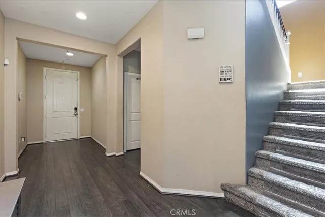 a view of an entryway with wooden floor