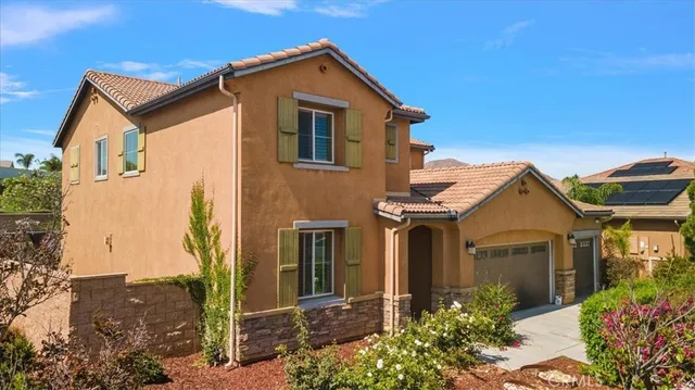 front view of a house with a small yard