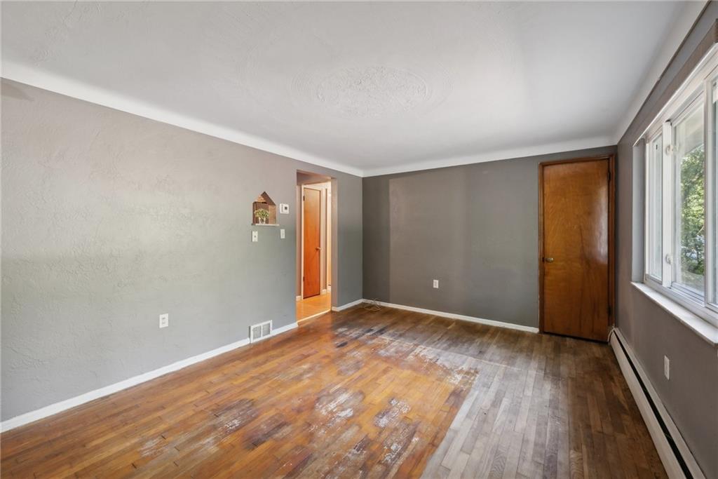 2074 Monroeville Road Monroeville, PA 15146 - Photo 11 of 26 wooden floor in an empty room with a window