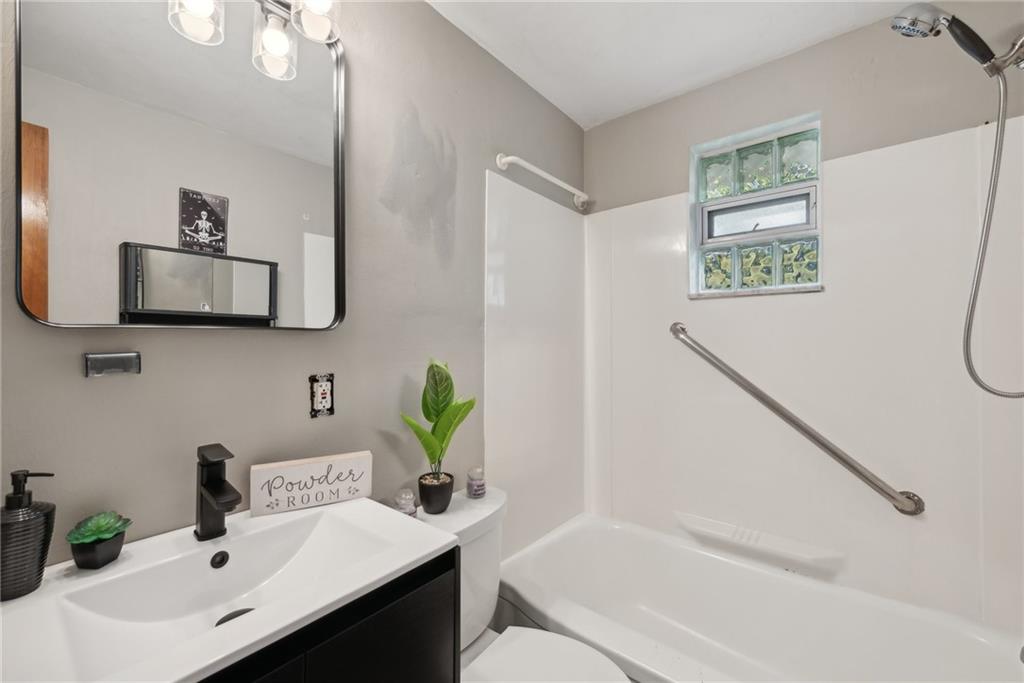 2074 Monroeville Road Monroeville, PA 15146 - Photo 16 of 26 a bathroom with a sink mirror vanity and toilet