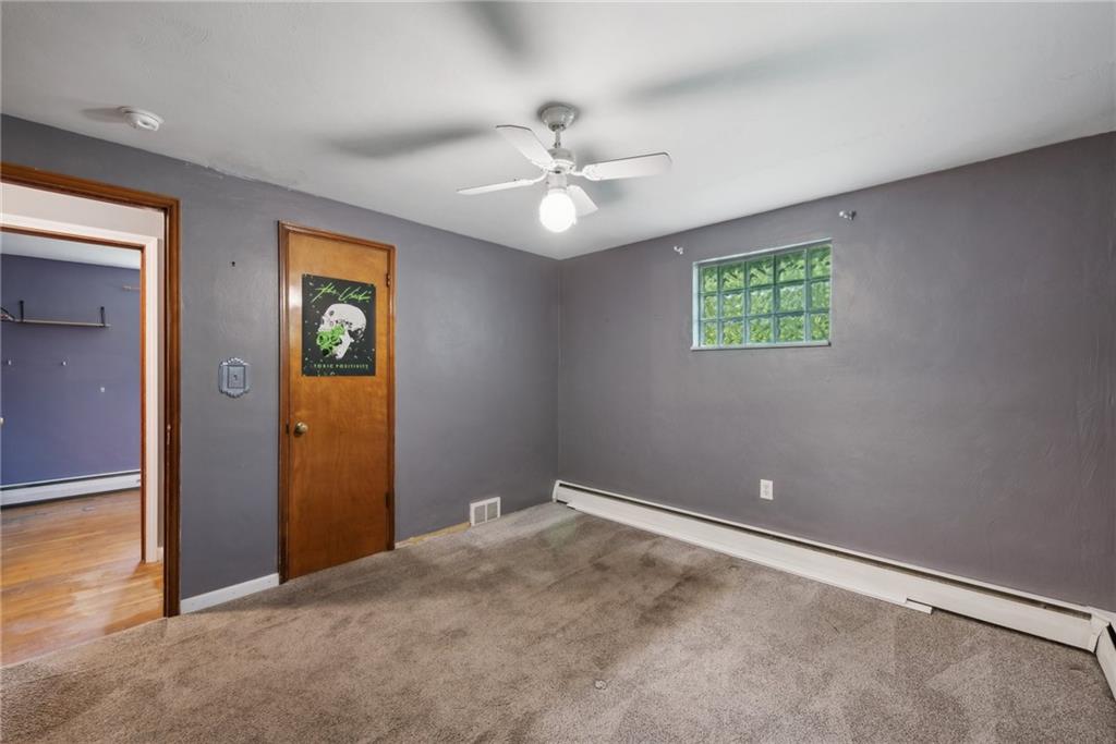2074 Monroeville Road Monroeville, PA 15146 - Photo 18 of 26 an empty room with window and ceiling fan