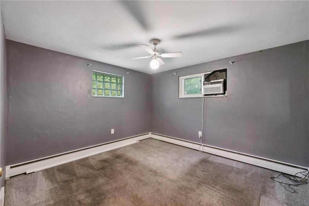 2074 Monroeville Road Monroeville, PA 15146 - Photo 19 of 26 an empty room with windows and ceiling fan