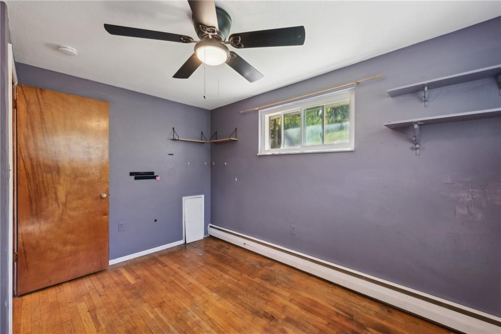 2074 Monroeville Road Monroeville, PA 15146 - Photo 20 of 26 a view of room with hardwood floor and ceiling fan