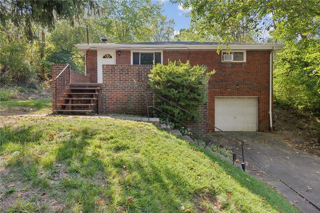 2074 Monroeville Road Monroeville, PA 15146 - Photo 2 of 26 a front view of a house with garden