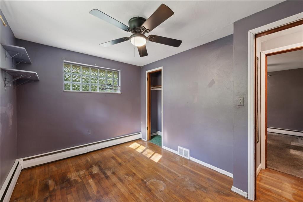 2074 Monroeville Road Monroeville, PA 15146 - Photo 21 of 26 an empty room with wooden floor and windows