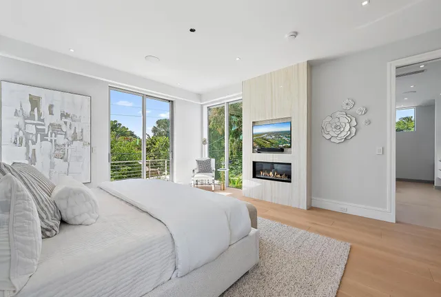 a bedroom with a large bed and a window