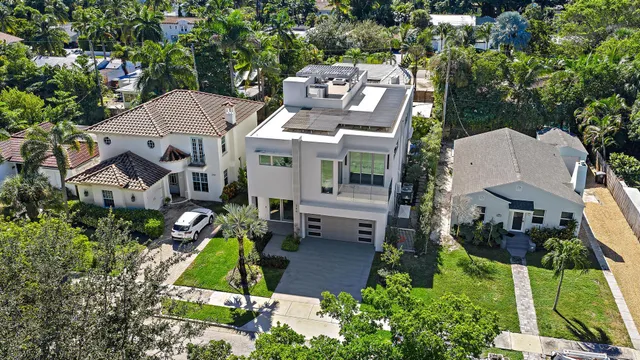 an aerial view of a house with a garden