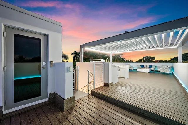 a view of a balcony with wooden floor