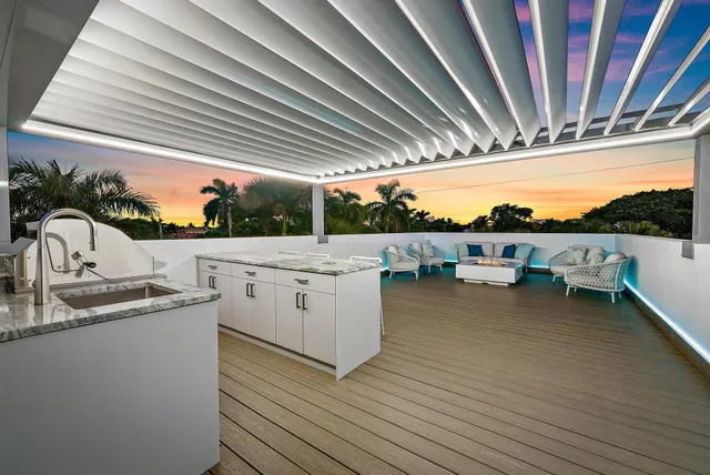 a kitchen with a sink and wooden floor