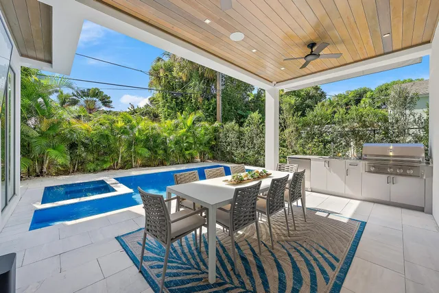 a view of a patio with a table chairs and a table