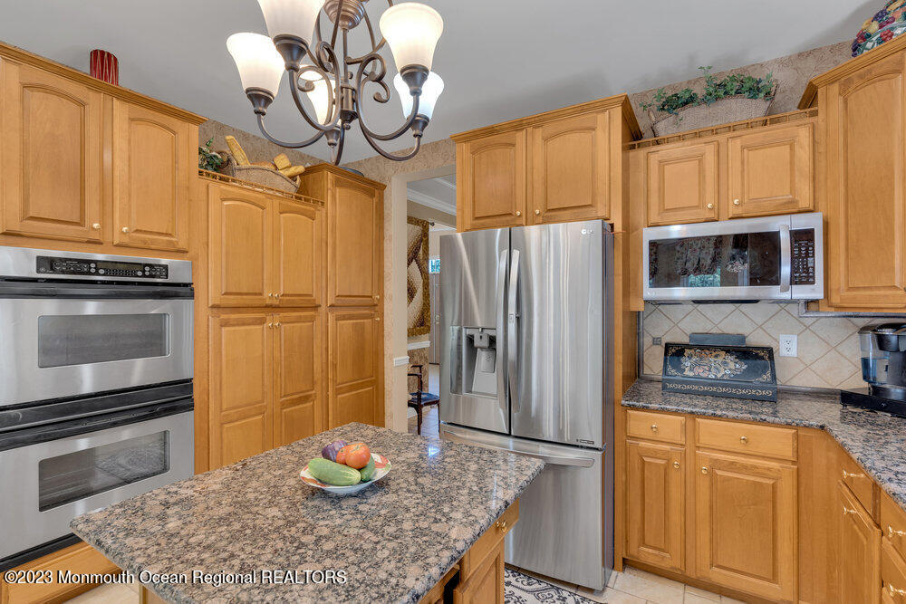 160 Butterfly Road Jackson, NJ 08527 - Photo 24 of 74 a kitchen with stainless steel appliances granite countertop a sink refrigerator and microwave