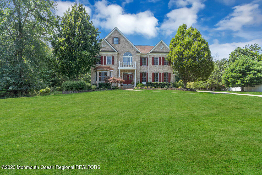160 Butterfly Road Jackson, NJ 08527 - Photo 6 of 74 a view of a house with a big yard and large trees