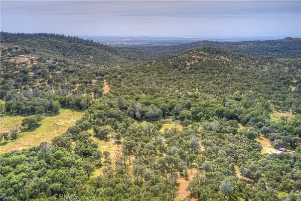 a view of a city with mountains in the background