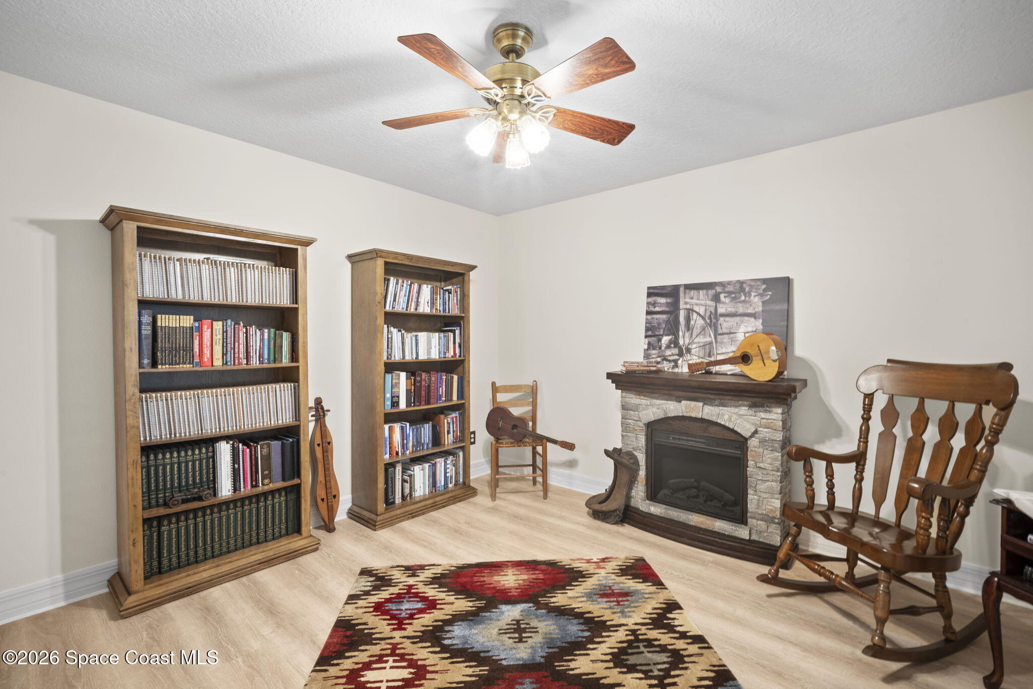 3125 Davis Road Mims, FL 32754 - Photo 23 of 47 a living room with furniture and a fireplace