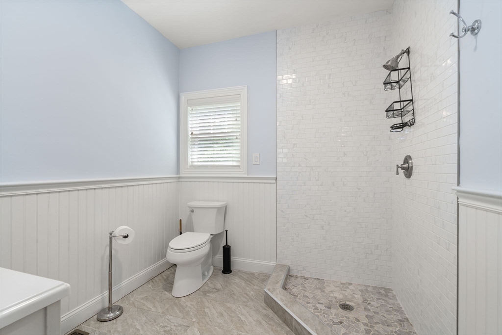24 Wayside Inn Road Framingham, MA 01701 - Photo 25 of 38 a bathroom with a toilet and a window