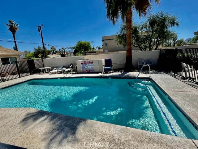 73740 Santa Rosa Way, Unit C Palm Desert, CA 92260 - Photo 1 of 18 a view of a backyard with sitting area