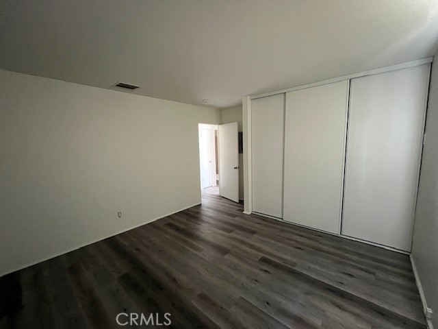 73740 Santa Rosa Way, Unit C Palm Desert, CA 92260 - Photo 14 of 18 a view of an empty room and wooden floor