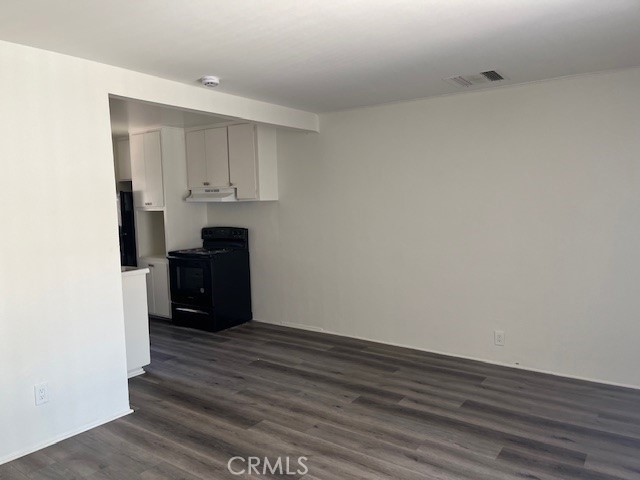 73740 Santa Rosa Way, Unit C Palm Desert, CA 92260 - Photo 6 of 18 a view of an empty room with a kitchen