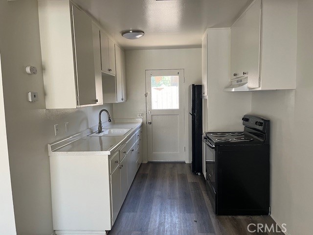 73740 Santa Rosa Way, Unit C Palm Desert, CA 92260 - Photo 9 of 18 a kitchen with a sink stove and refrigerator