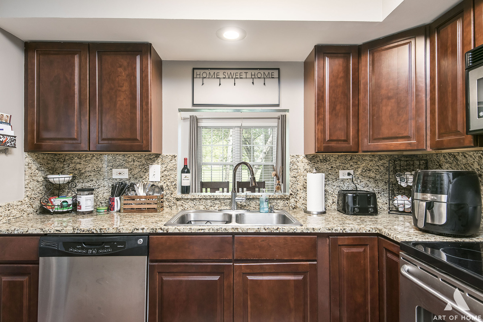 19 Foxcroft Road, Unit 131 Naperville, IL 60565 - Photo 12 of 22 a kitchen with stainless steel appliances granite countertop a sink dishwasher a stove and cabinets