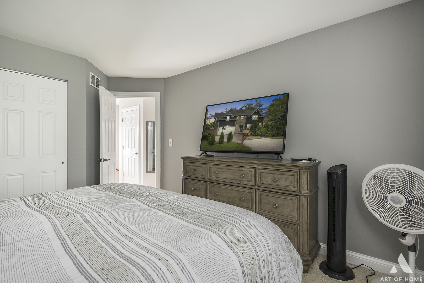 19 Foxcroft Road, Unit 131 Naperville, IL 60565 - Photo 18 of 22 a bedroom with a bed and a television