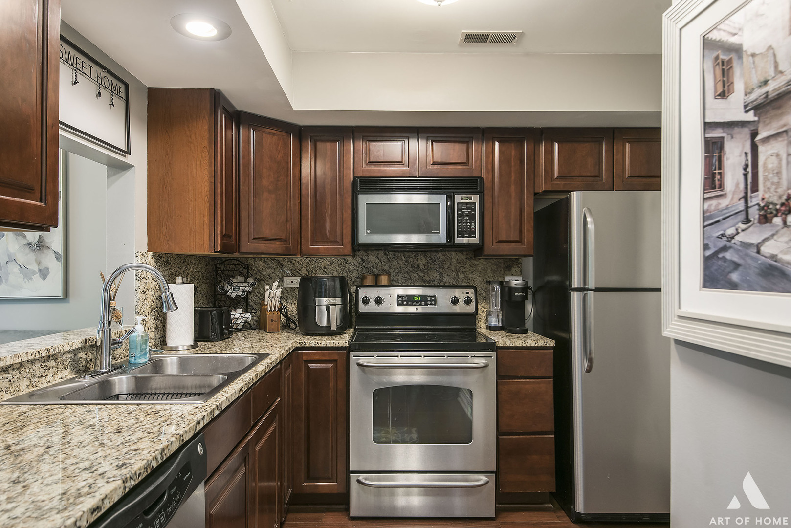 19 Foxcroft Road, Unit 131 Naperville, IL 60565 - Photo 10 of 22 a kitchen with granite countertop a refrigerator stove and microwave
