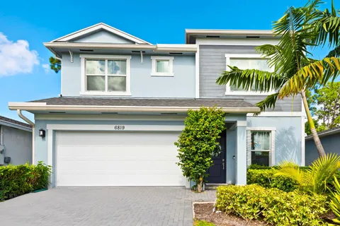 a front view of a house with a garage