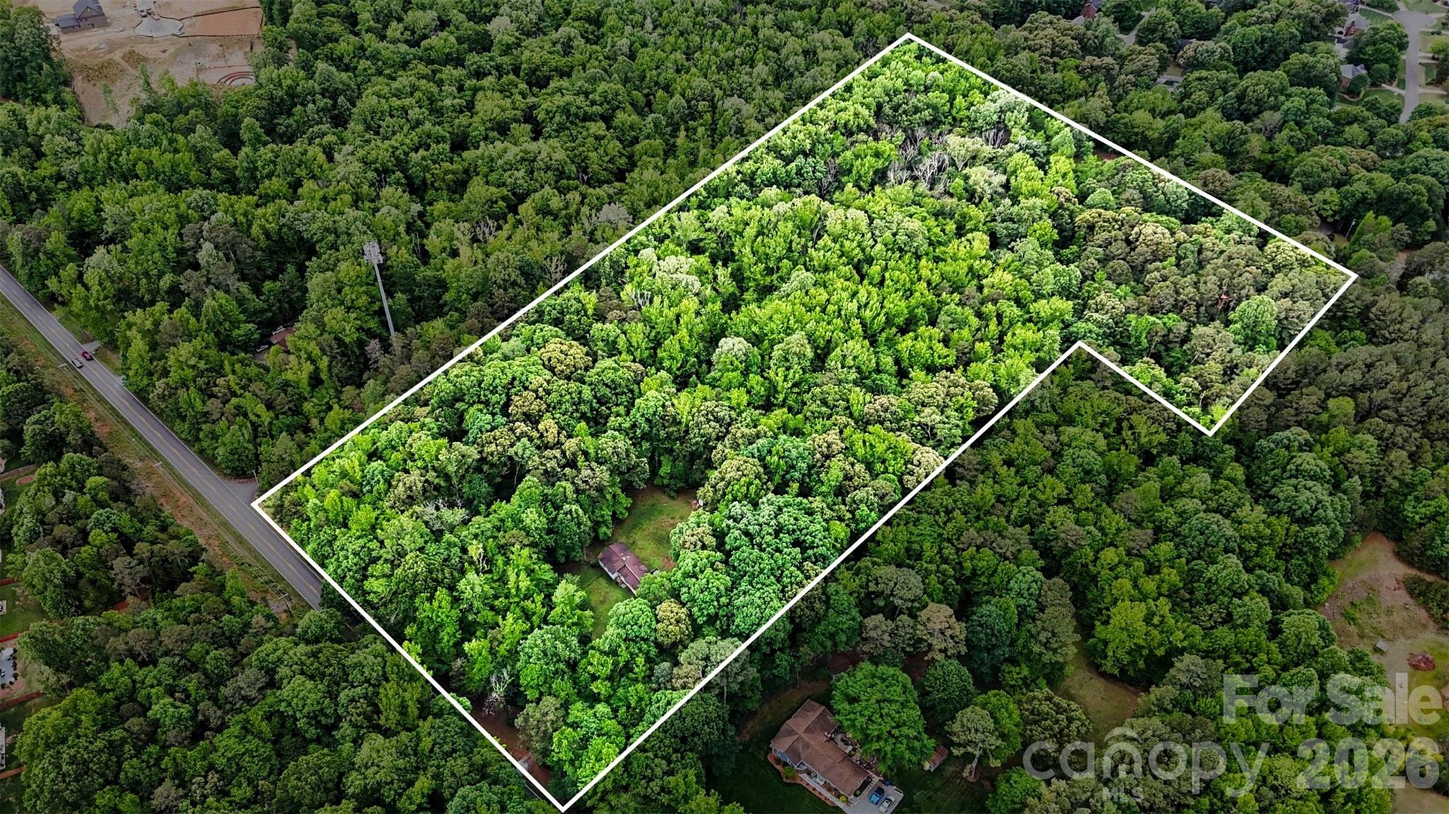 1116 Billy Howey Road Waxhaw, NC 28173 - Photo 1 of 19 view of a green field with lots of bushes