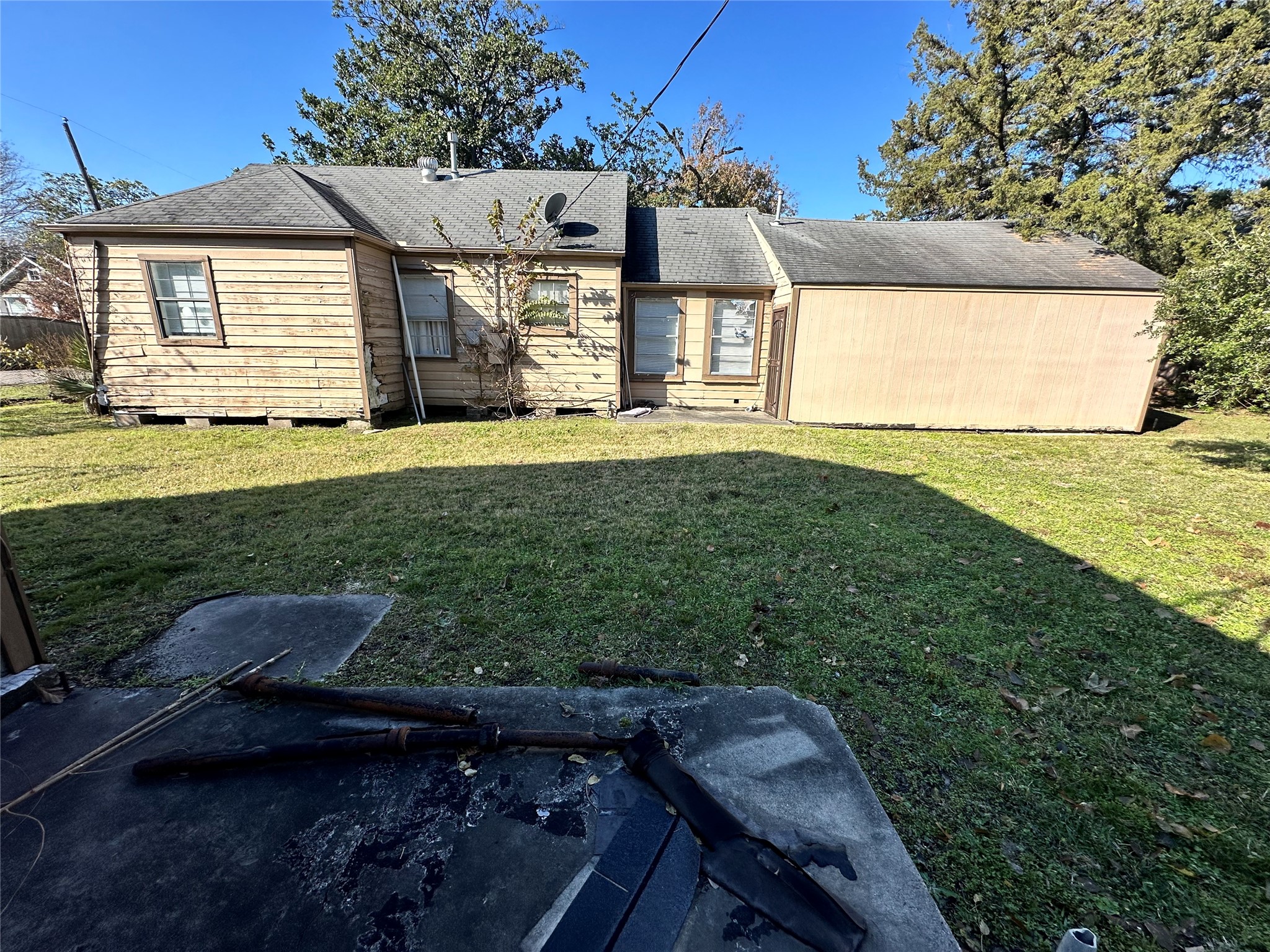 1502 Tabor Street Houston, TX 77009 - Photo 12 of 27 a front view of a house with a garden and yard