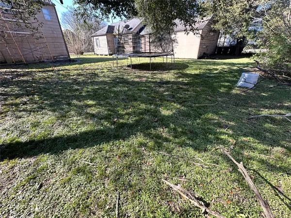 a view of backyard with green space