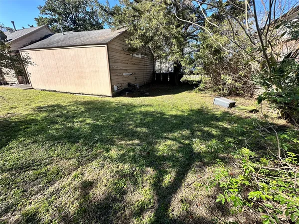 a view of a lake with a yard