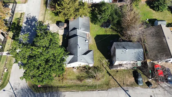an aerial view of houses with outdoor space