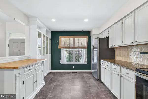a view of a kitchen with electric appliances