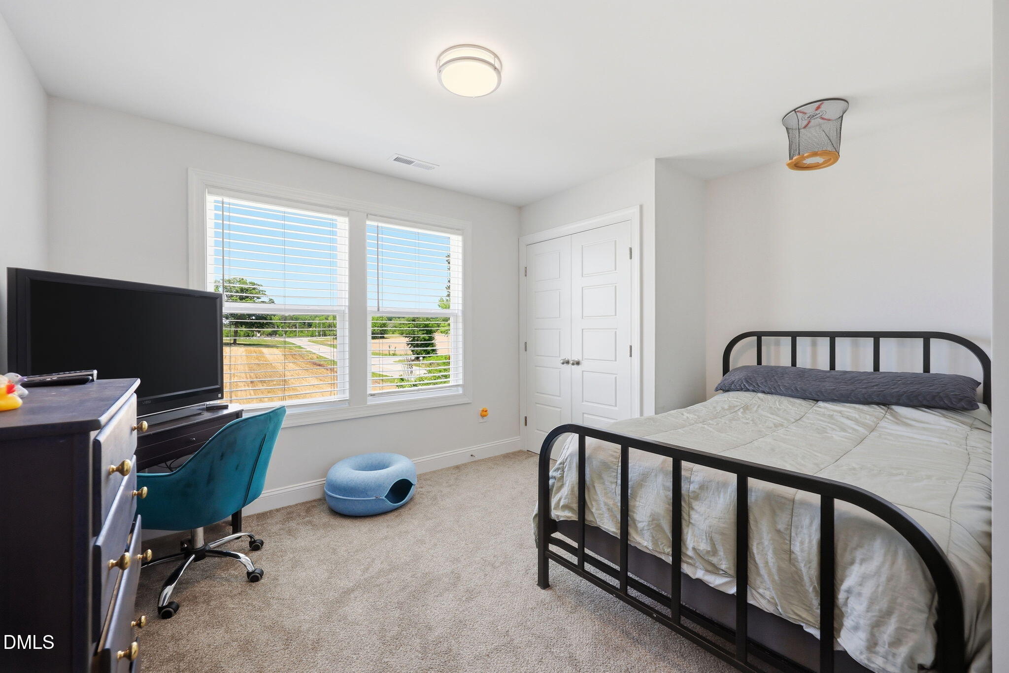 104 Kavanaugh Road Wake Forest, NC 27587 - Photo 21 of 36 a bedroom with furniture a window and a flat screen tv