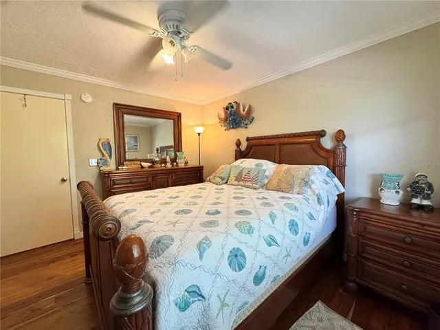 a living room with furniture a piano and a flat screen tv