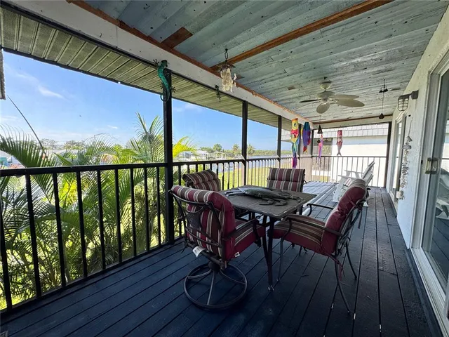 a kitchen with a refrigerator a sink and cabinets
